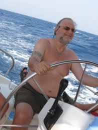 Mike at the helm of a Sun Odyssey 43 in the Southern Aegean, August '08